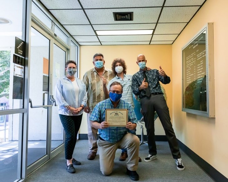 Professors with the Moving the Needle Award for 2020-2021, left to right, Deidre Seker (Psychology), Nick Petropouleas (Geography), Dr. Jared Rothstein (Philosophy), Lewis Metzger (History), and Dr. Michael Flota, kneeling (Chair), photo credit: Alex Espinal