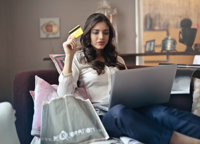 picture of woman holding credit card