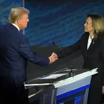 Former President Donald Trump and Vice President Kamala Harris shaking hands at the presidential debate.